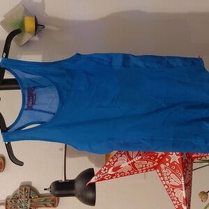 Blue racerback tank with semisheer back and small pocket on front